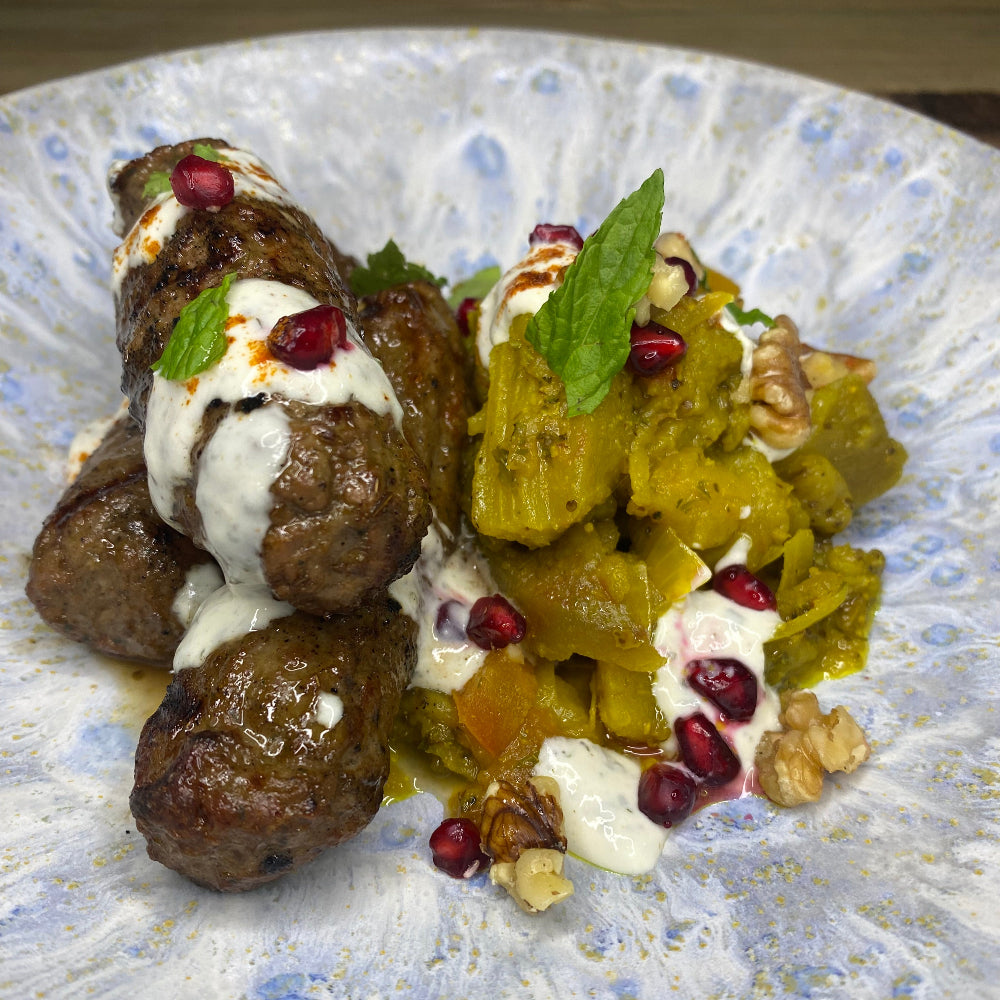 Grilled lamb koftas, persian spiced eggplant, garlic mint yoghurt pomegranate & walnuts