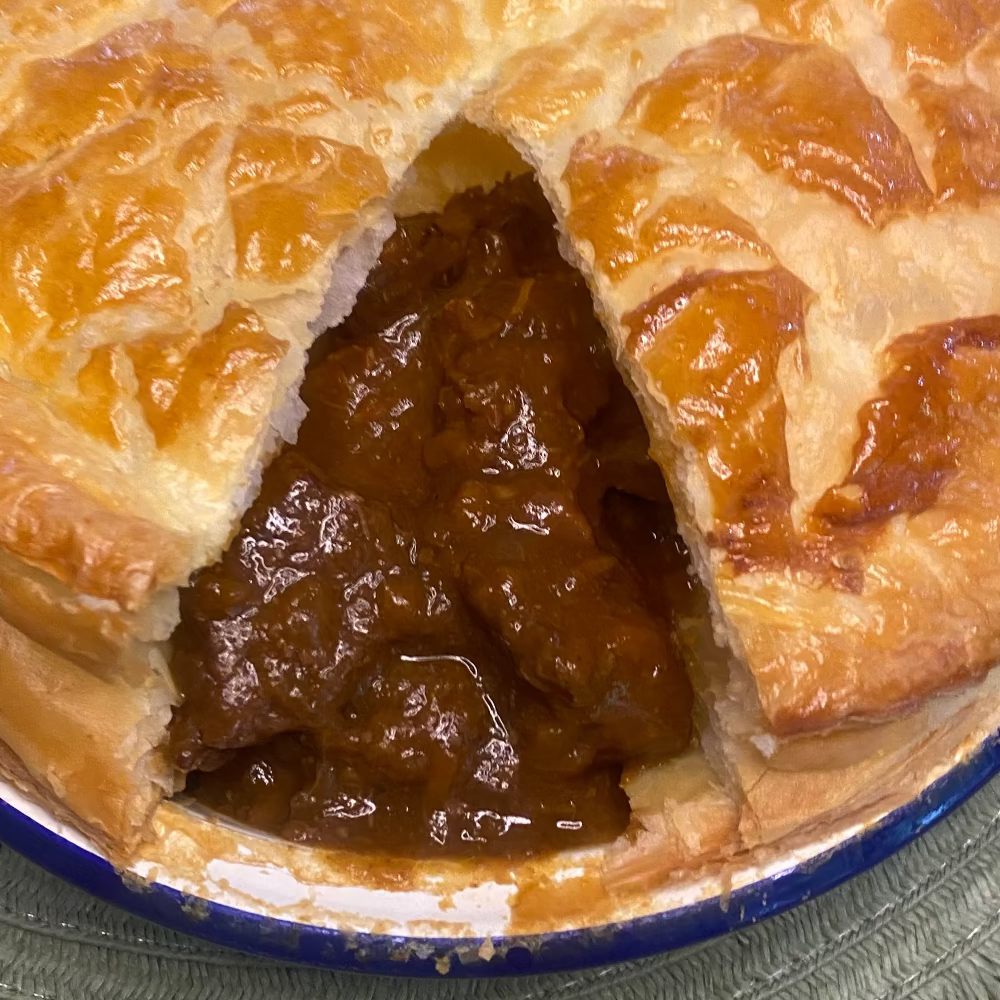 Beef and stout pie with golden puff pastry top