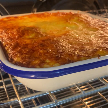 Beef lasagne in the oven with a nice golden cheesy glaze