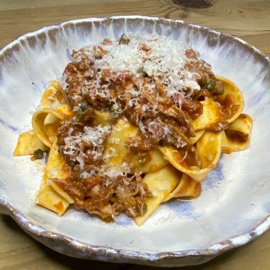 Slow cooked duck ragu with capers and papardelle pasta